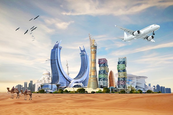 Aerial view of Doha skyline with Souq Waqif and Katara Cultural Village, showcasing Qatar’s 2025 tourism appeal.